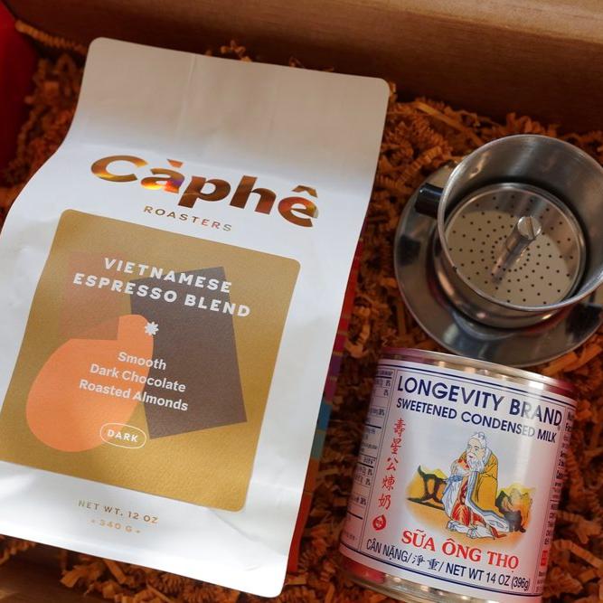 Display of Vietnamese Expresso Blend coffee bag next to sweetened condensed milk and frother
