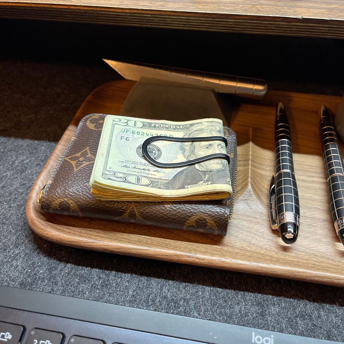 Craighill money clip on top of wallet