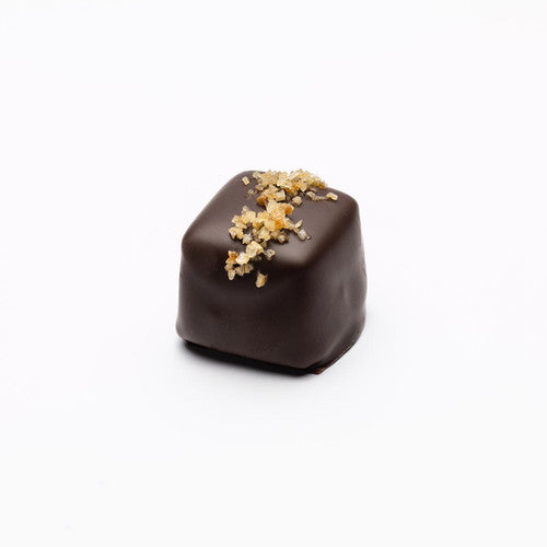 one piece of square chocolate with sea salt and habanero sprinkled on top