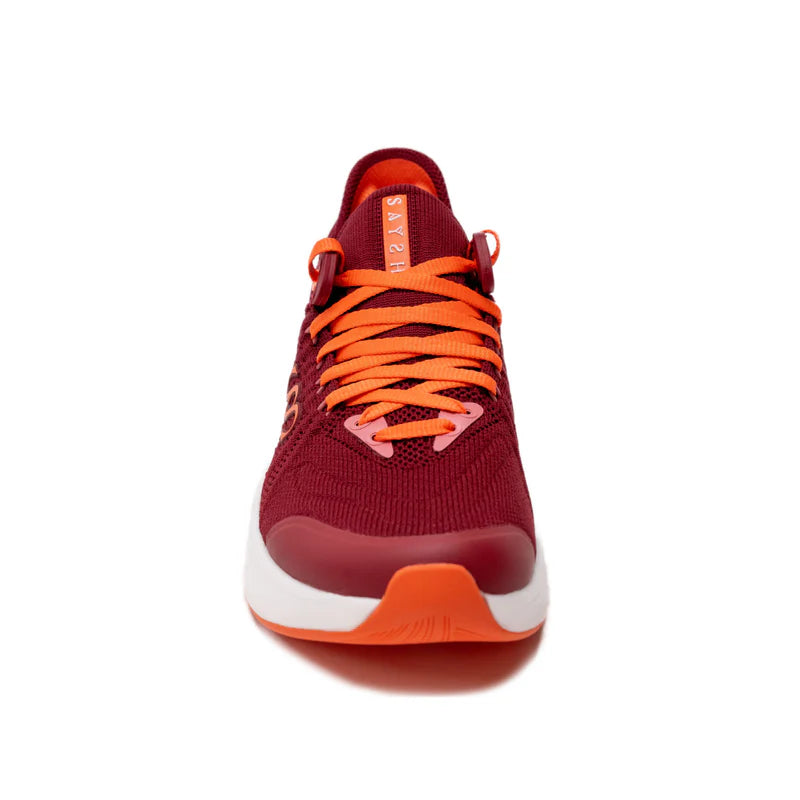 Red sneakers with orange laces frontal view