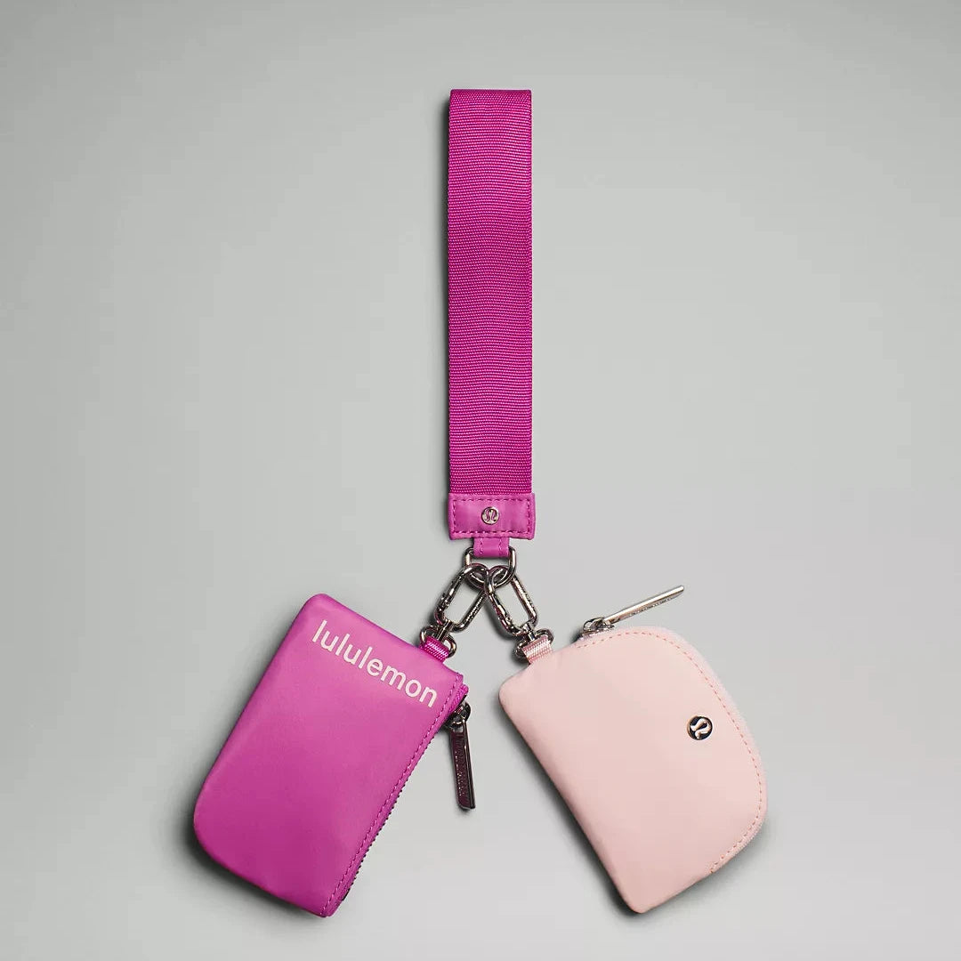 Pink dual pouch on wristlet with lululemon branding