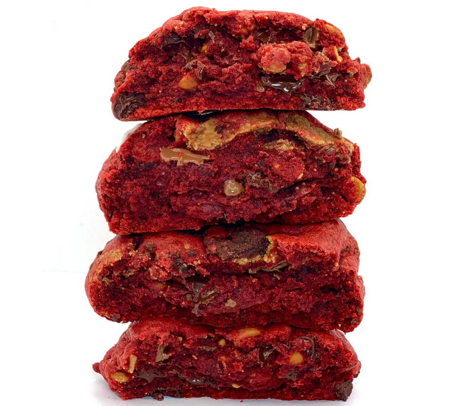 Four red velvet brownie cookies stacked on top of each other