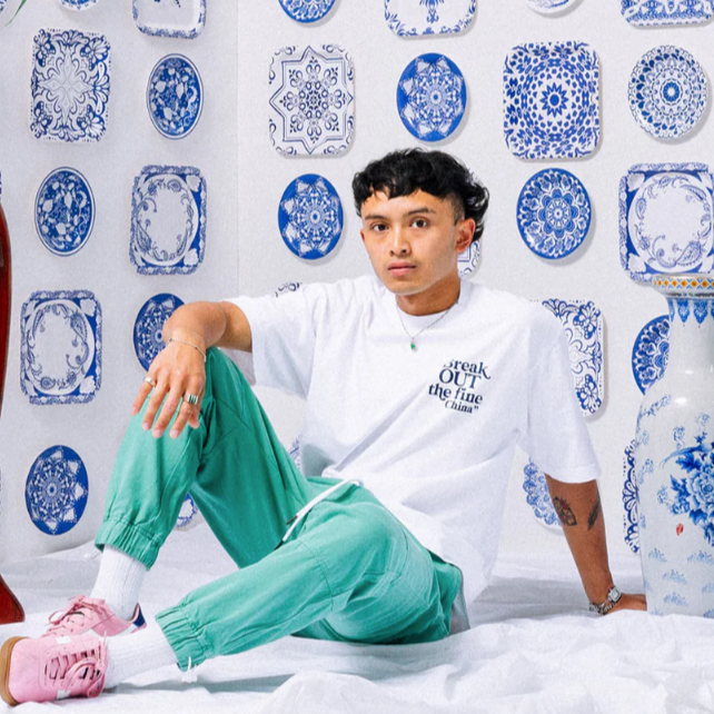 Model wearing white t-shirtt "Break OUT the fine China"