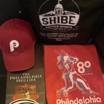 Shibe PHILLIES gift set showing everything Phillies--a book, baseball cap, t-shirt, koozie, sticker