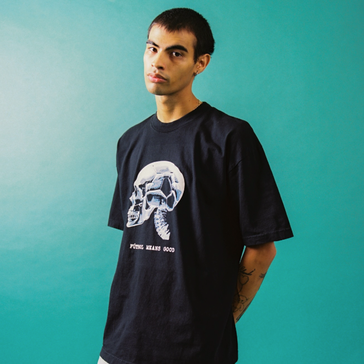 Model wearing black t-shirt with skull