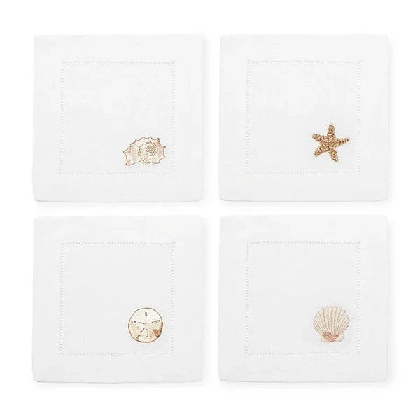 set of four linen cocktail napkins with different seashells for beach house