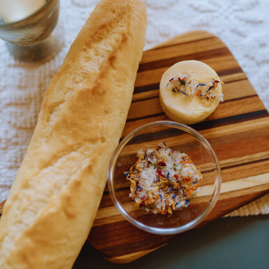 salt mixed with edible flower petals served with butter and bread