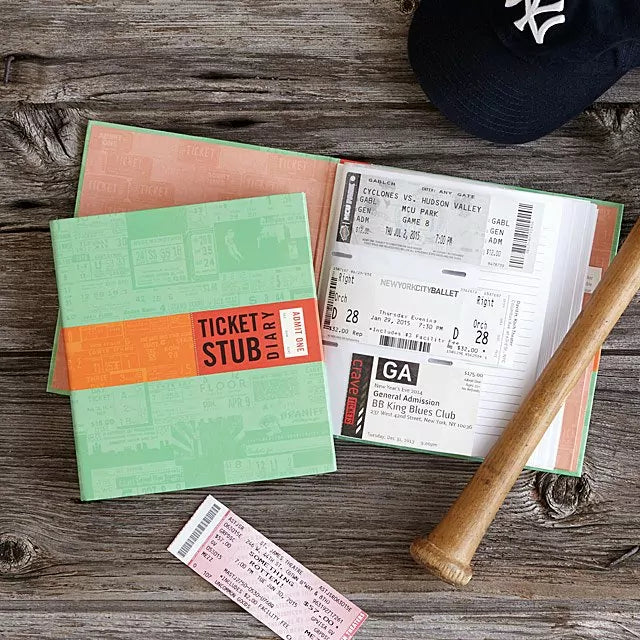 green book with inside sleeves to hold sticket stubs and write memories in margin
