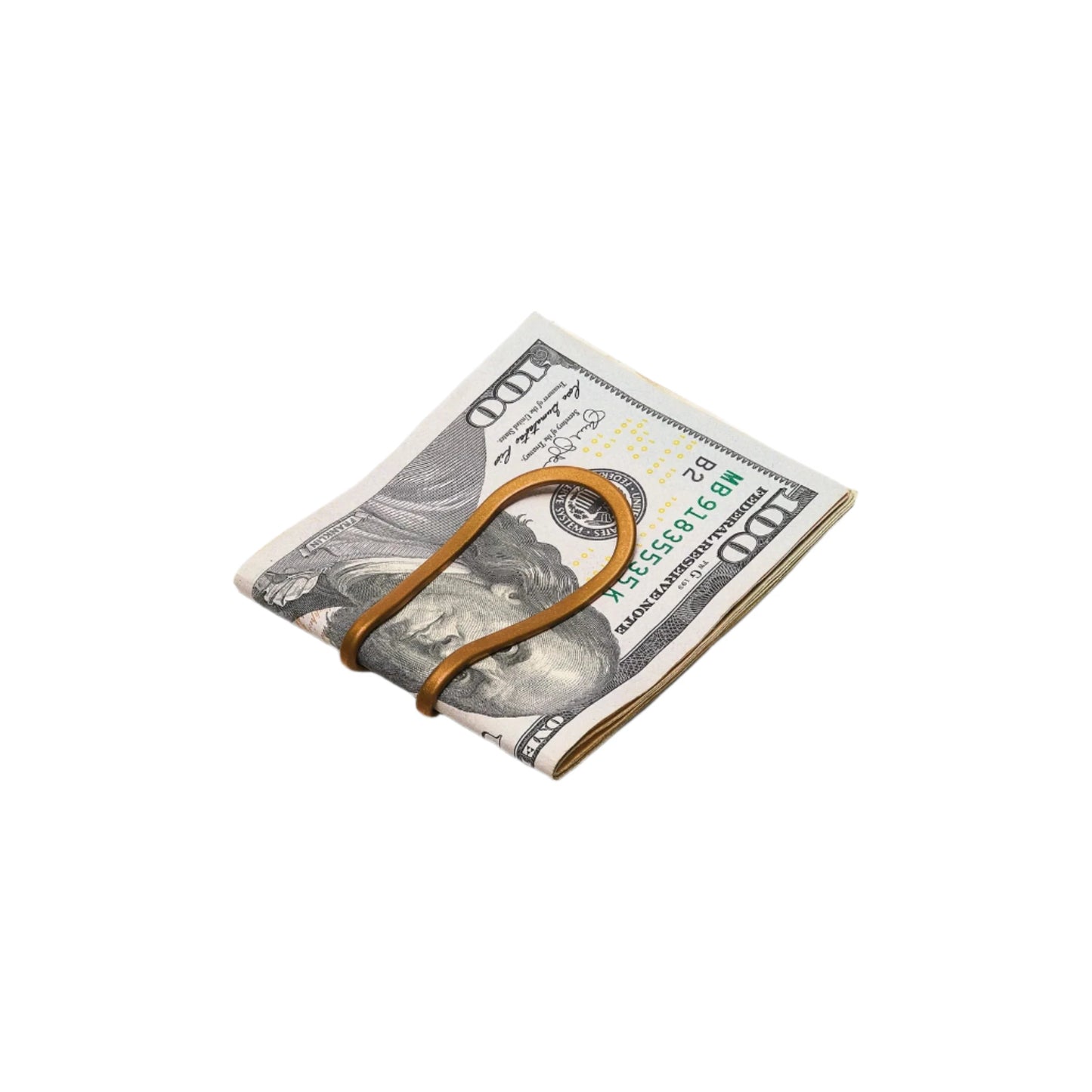 bronze money clip holding $100 bills