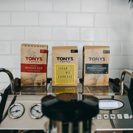 three bags of Tony's coffee on top of tray