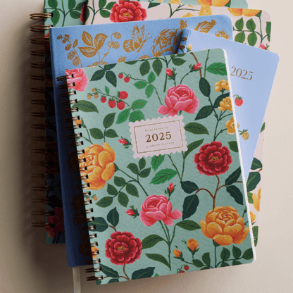 floral planners stacked on top of each other