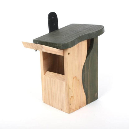 back of natural and green painted wooden bird house with opening to clean out between seasons