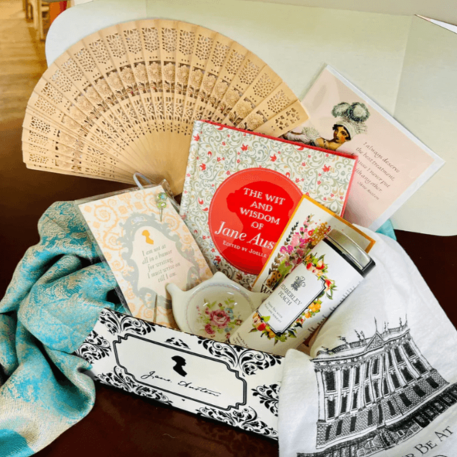 gift box with jane austen themed card, tea, stationary and fan