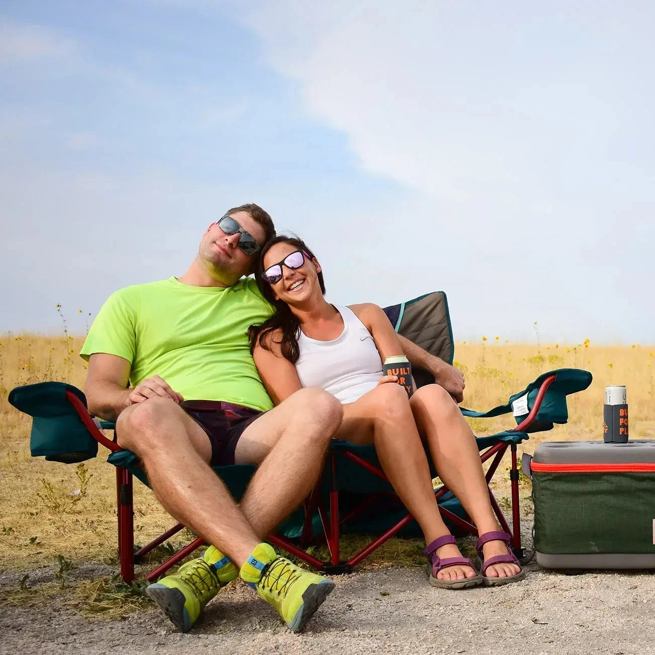 two people cuddling in loveseat outdoor chair