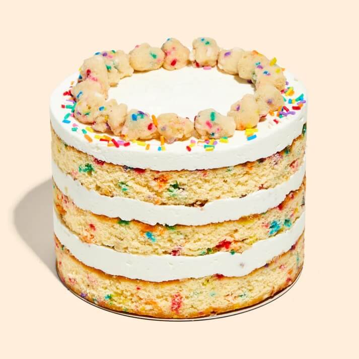 milk bar birthday cake against tan background