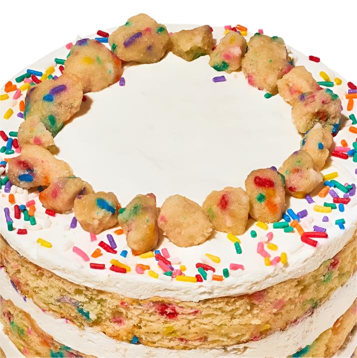 milk bar birthday cake top view with dough balls and sprinkles