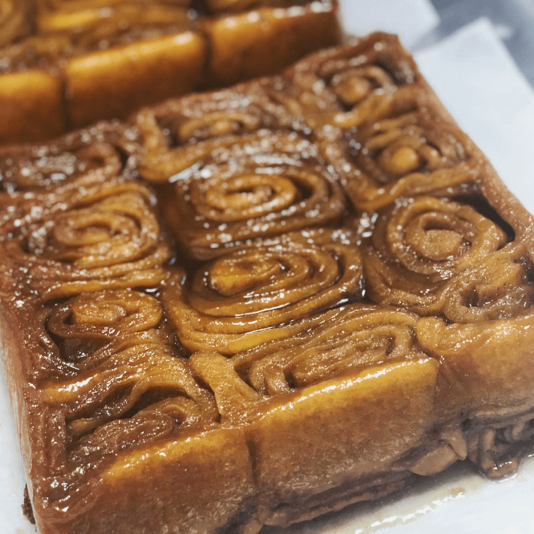 plain sticky buns in tray with swirls