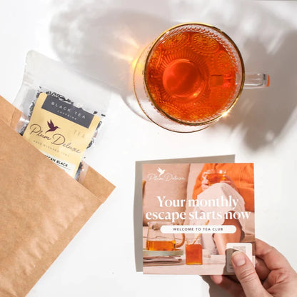 package of tea shown with info packet and tea mug