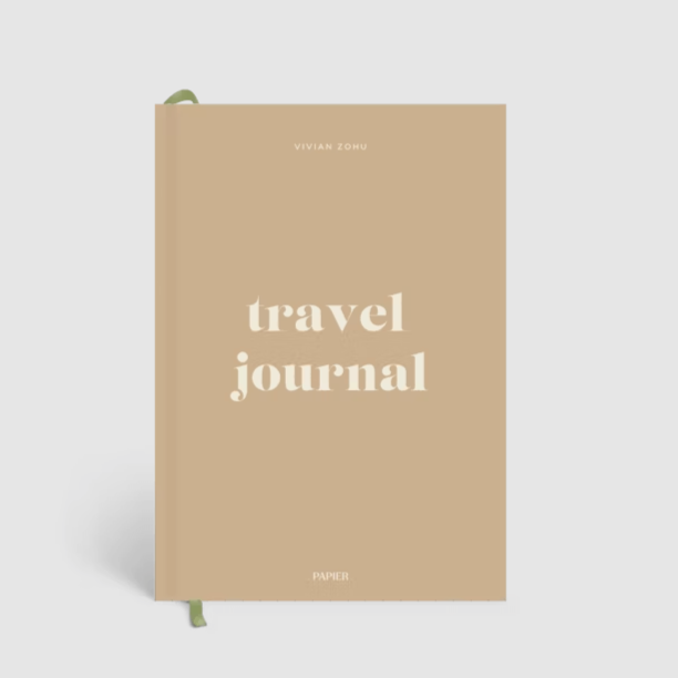 travel journal written on tan cover