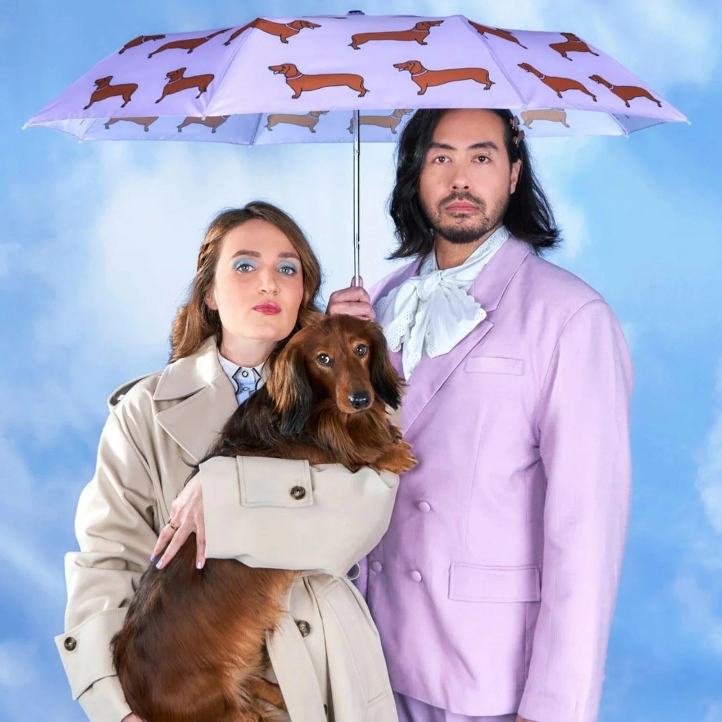 dachshund and purple print umbrella with models