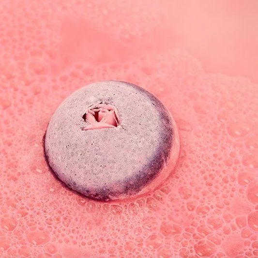 gift ideas for her pink and purple bath bomb in pink water