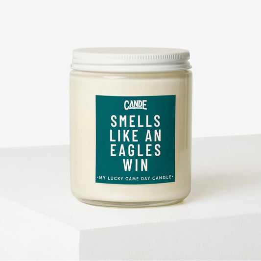 candle in a clear jar with "Smells like an Eagles win" printed on label